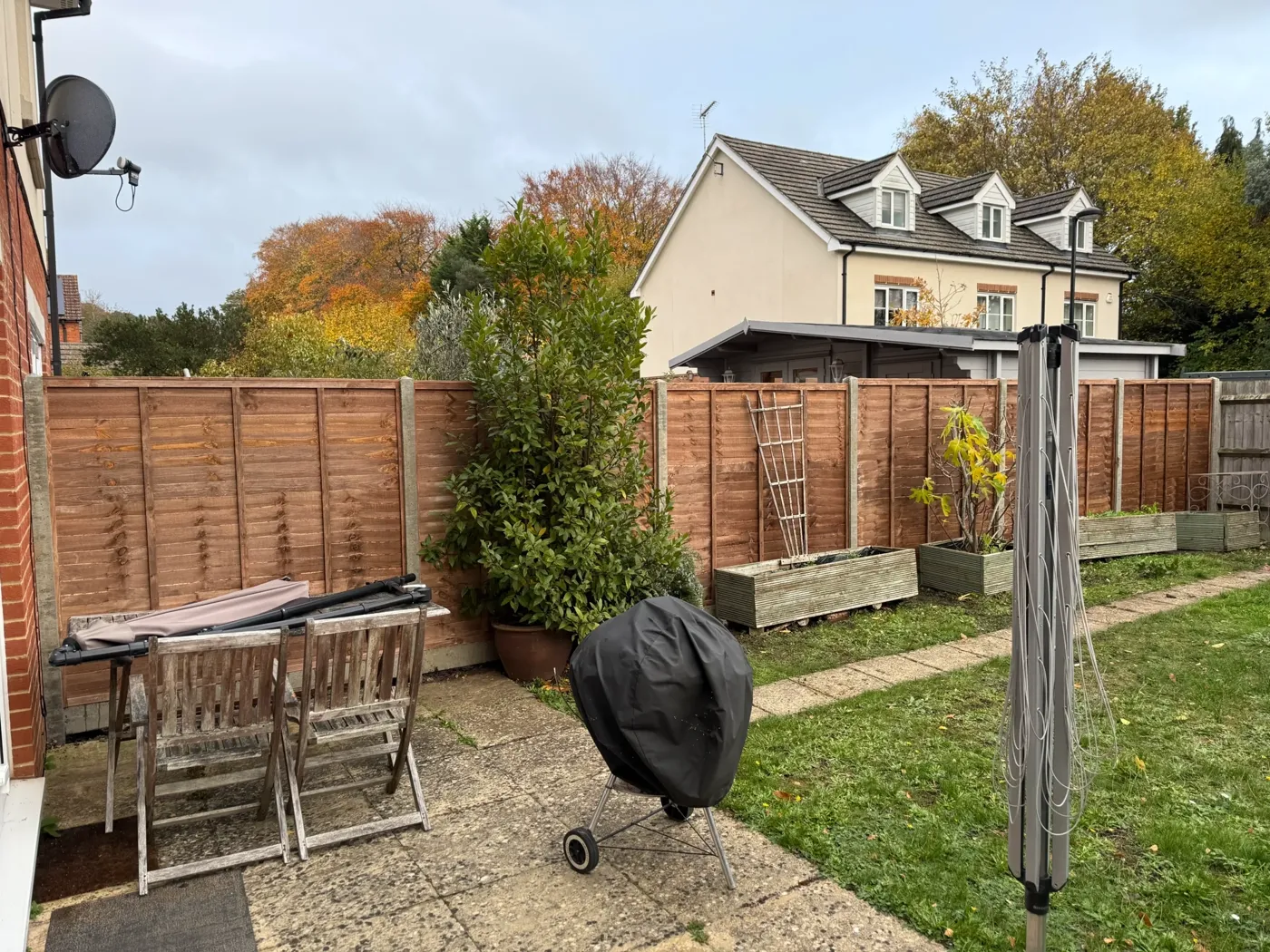 New timber fence installed along a garden boundary in Haslemere