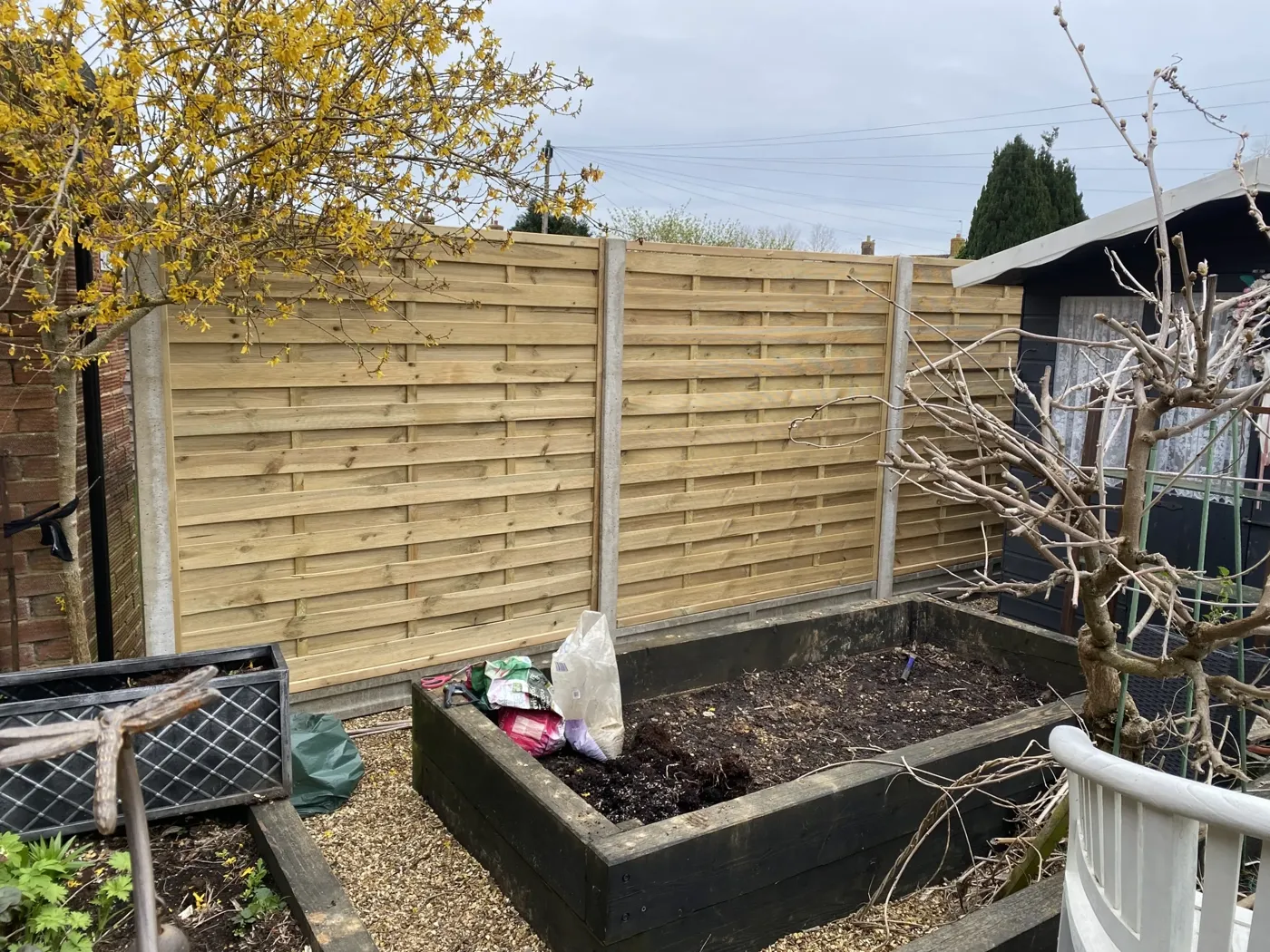 Completed garden fencing project in Haslemere