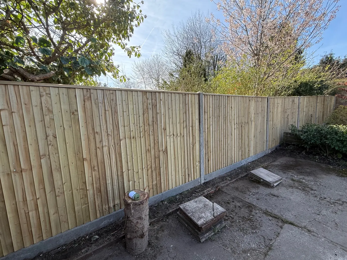 Closeboard fence with concrete posts and gravel boards in a Haslemere garden