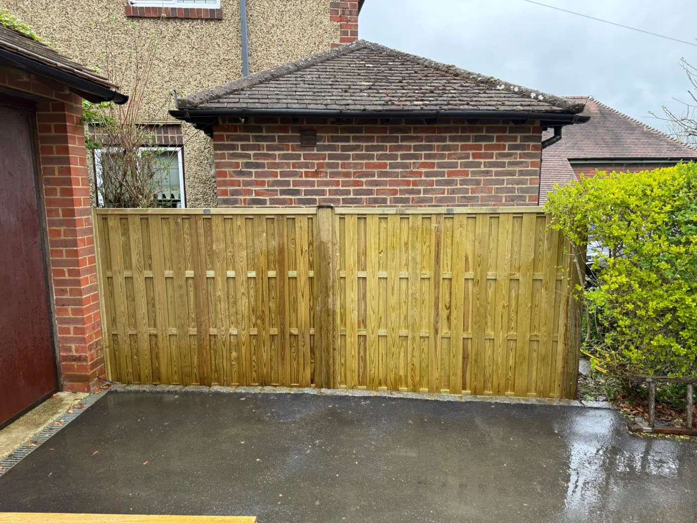 Tongue and groove timber driveway gates installed in Haslemere