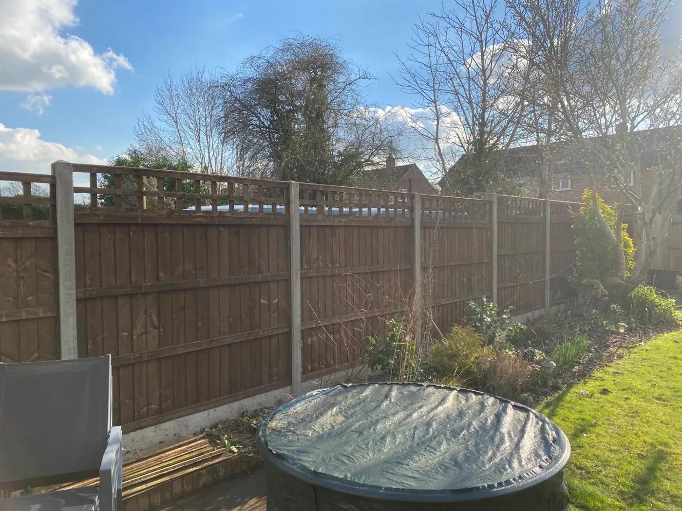 Trellis topped fence panels installed for added privacy in a Haslemere garden