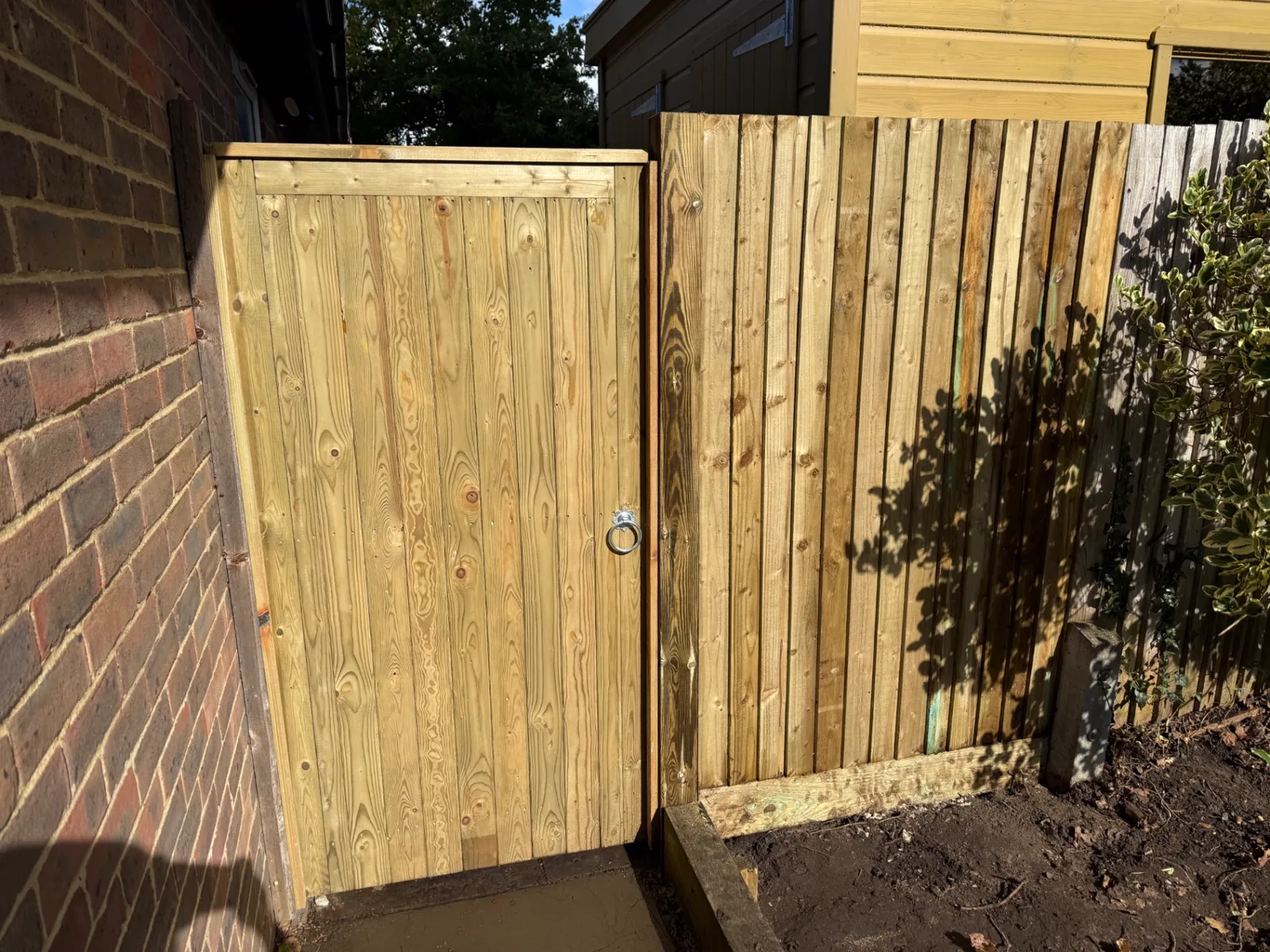New tongue and groove side gate fitted beside a house in Haslemere
